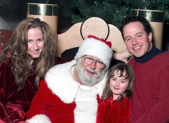 Jason, Lisa, and Chelsea Christensen mistake homeless man in mall to be store Santa; confused man politely agrees to photo with family sitting on his lap.
Jason C Christensen
01 Jan 2005