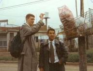 Garbage is placed in sacks, and then placed in baskets or hung on nails on the utility post to be picked up.