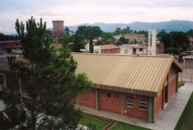 I really like this picture. The chapel is in kind of a trashy part of town, but I climbed up on the water tower to get this aerial view where you can see the tower (it looks nuclear but it's not) of Zapla in the background.
David  Sallay
24 May 2004