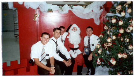 Can't miss doing this at Christmas.  Santa looks like he is going to die from heat stroke.  Elder Taylor, Elder Kautsoukos, Elder Garrett, Santa and Elder Carter
Meikle  Garrett
28 Apr 2002