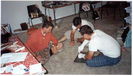 Christmas Eve playing the Chocolate game.  Elder Garrett, Elder Koutsoukos, and Elder Carter in Quacker Hill
Meikle  Garrett
28 Apr 2002