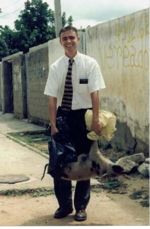 Elder Brockbank holding a pig that was hit by a car on our way home from lunch. He carried it back to Maranalva's (Juazeiro) and she gave it to somebody to slaughter.
Joseph C Windham
07 Jul 2002