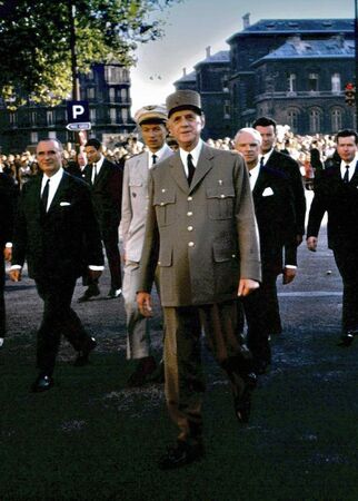 Picture taken on Aug 25, 1964, before Pres de Gaulle spoke at the 20th Celebration of Liberation of Paris.  He walked toward me and my companion.  I took the picture and he took our hands in his.
Christopher W Evenson
09 Feb 2005