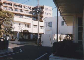 JTNM Honbu - Mission office on 1st floor and elders' apartment on 2nd floor of buliding at left, Mission President's home at right-center, and chapel on far right.
Christopher P. Staggs
16 Mar 2003