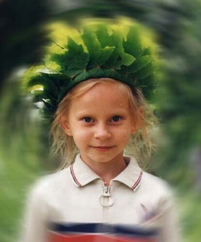 This was taken on a multi-ward picnic in the summer of '97, and shows the simple beauty in making a crown of leaves.  I don't know this girl's name.
Joshua Aaron Jones
12 Jun 2003