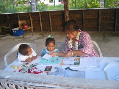 Sister Welsh was getting her display ready to teach the sisters of the small branch of Fakarava.   These 2 children had a blast as she showed them her flannel boards and drawings of figures and pictures to help the children learn about stories in the scriptures and help families enjoy Family Home Evening.
Erica Welsh-Grover
06 Aug 2003