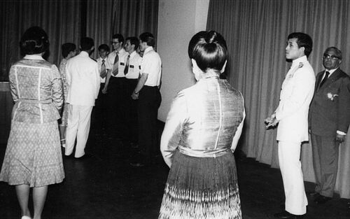 The King and Queen of Thailand greet Elders (L to R) Fletcher, Furch, James Leigh, and Patterson while the Princess and Prince look on. These elders performed as the musical group 