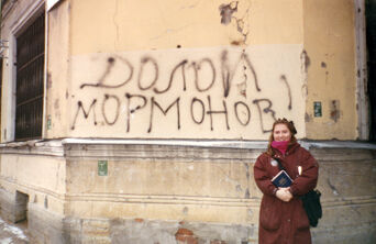 Sister Sveta Kigim on mission from Kiev to St Petersburg outside her apartment building where someone spray painted 'Down with the Mormons' on the wall - she stands in defiance of the statement.
Rex  Griffiths
10 Apr 2005